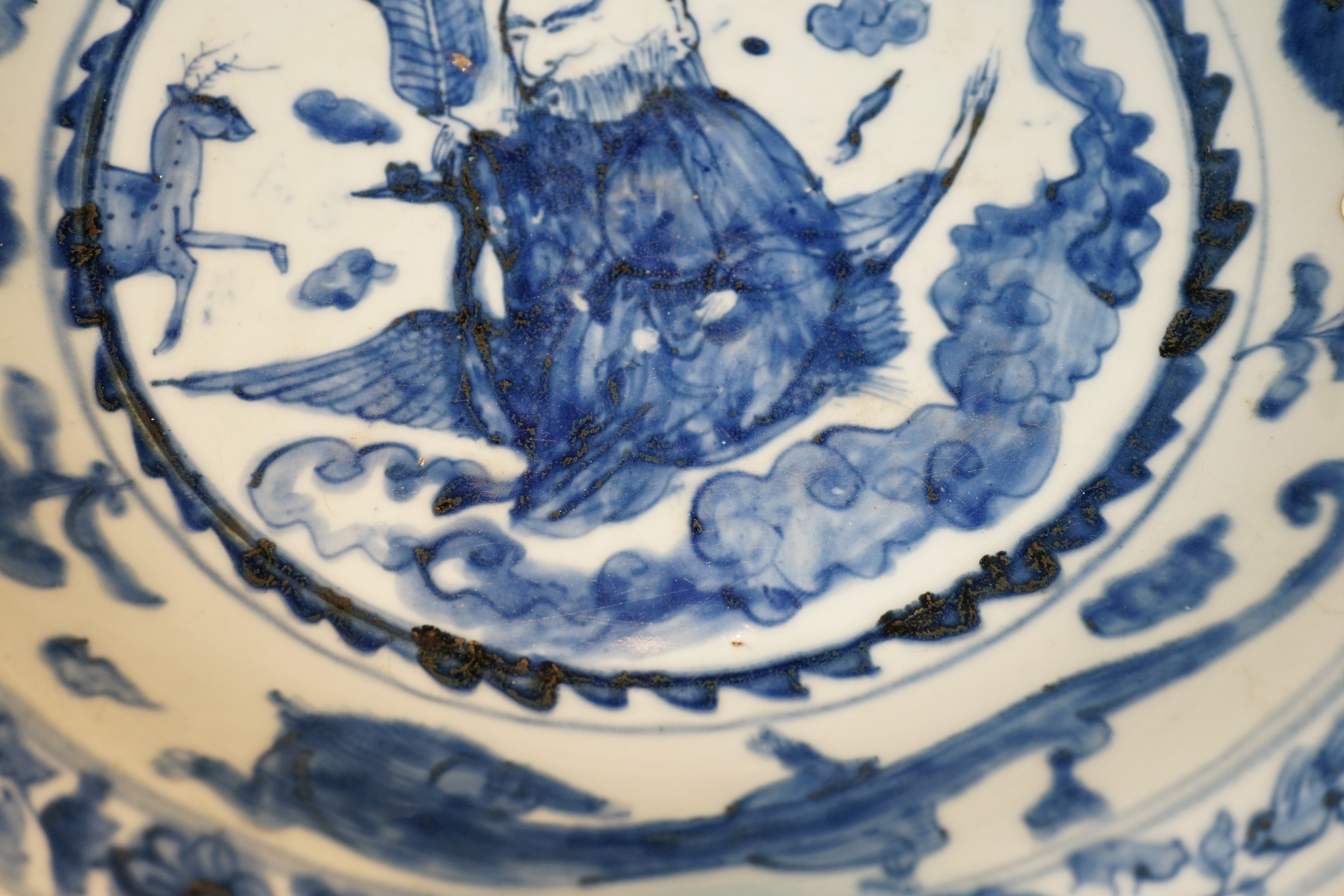 A large Chinese Swatow blue and white ‘Shou Lao’ dish, Zhangzhou kilns, Wanli period, 43.4cm diameter, tiny rim chip